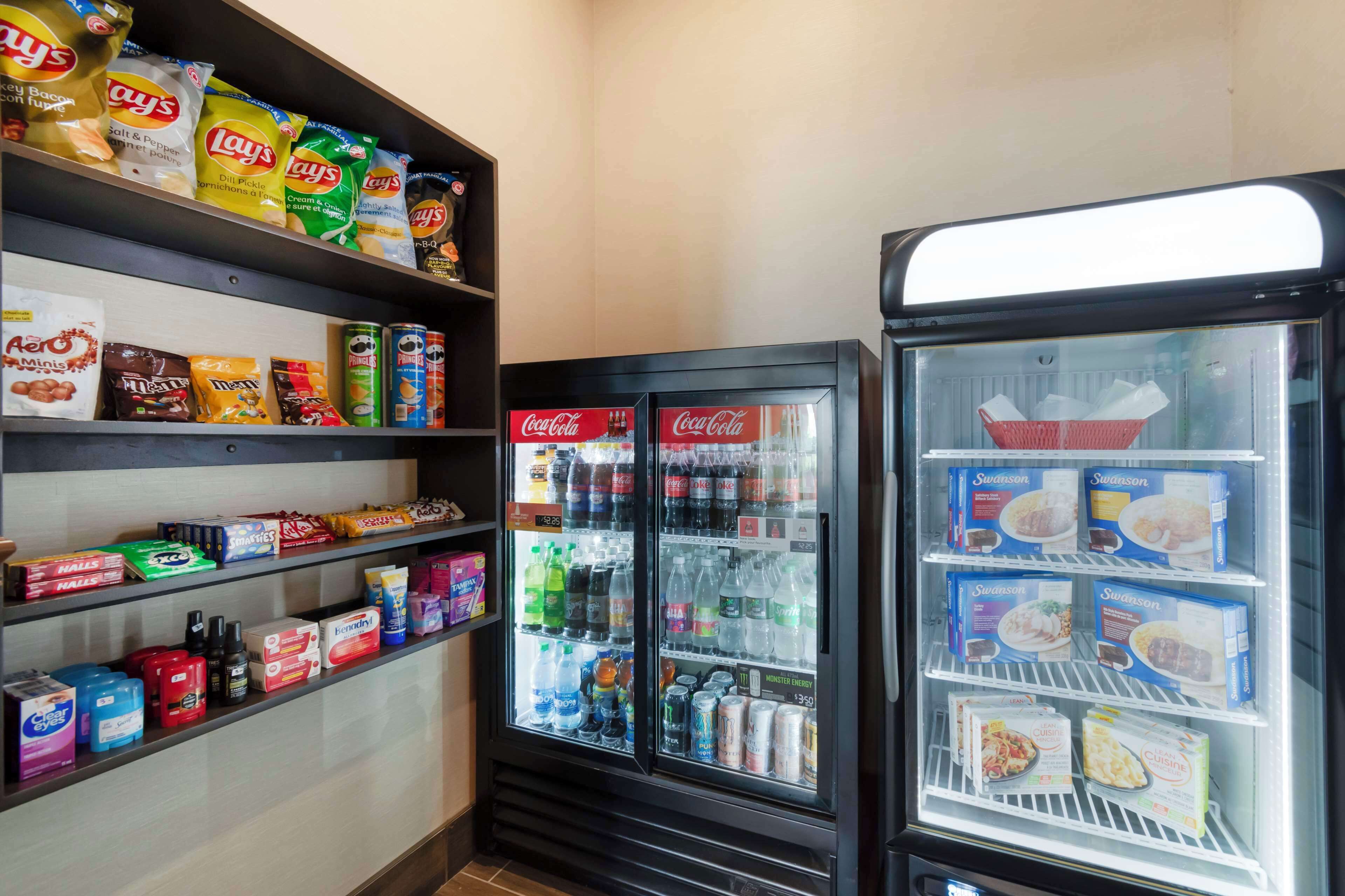 A vending area with snacks and beverages, including Lay's chips and Coca-Cola.