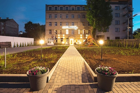 Front of property - evening/night. RigaApartment SoNaDA Self Check-in Aparthotel, Center, Private Parking
