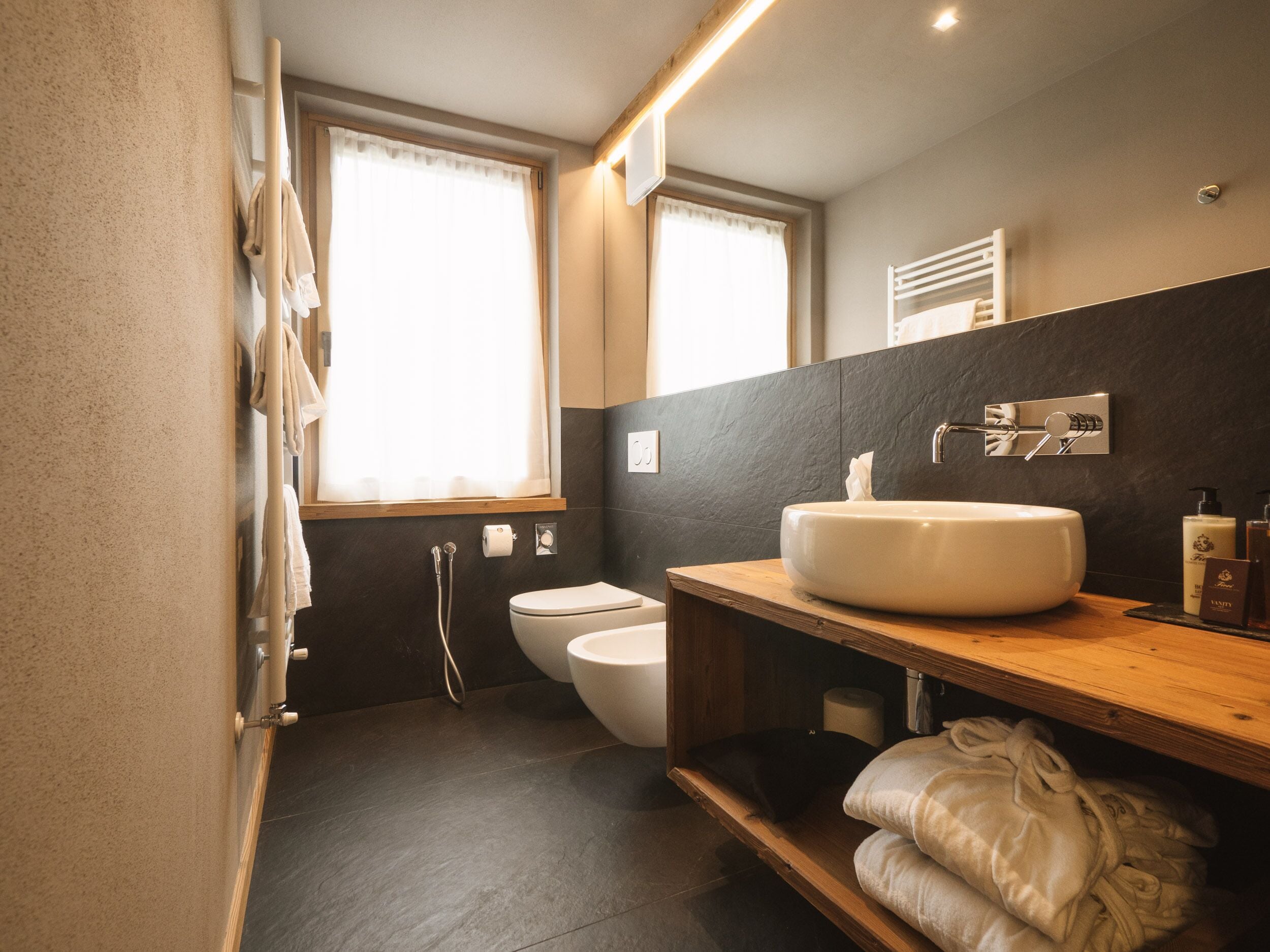 spa suite with jacuzzi and sauna | bathroom | shower, rainfall showerhead, free toiletries, hair dryer