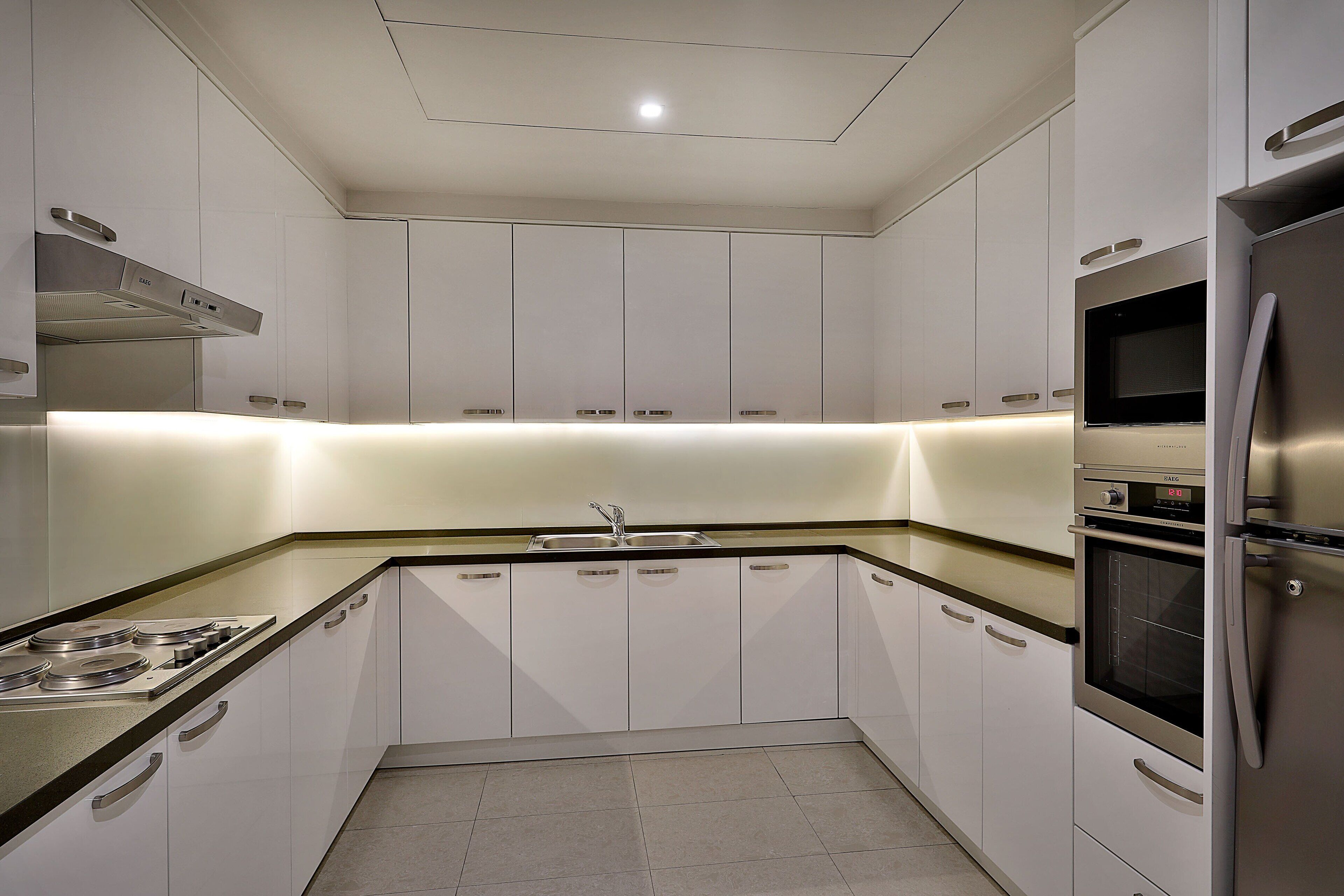 mini-fridge, espresso maker, electric kettle, kitchen islands