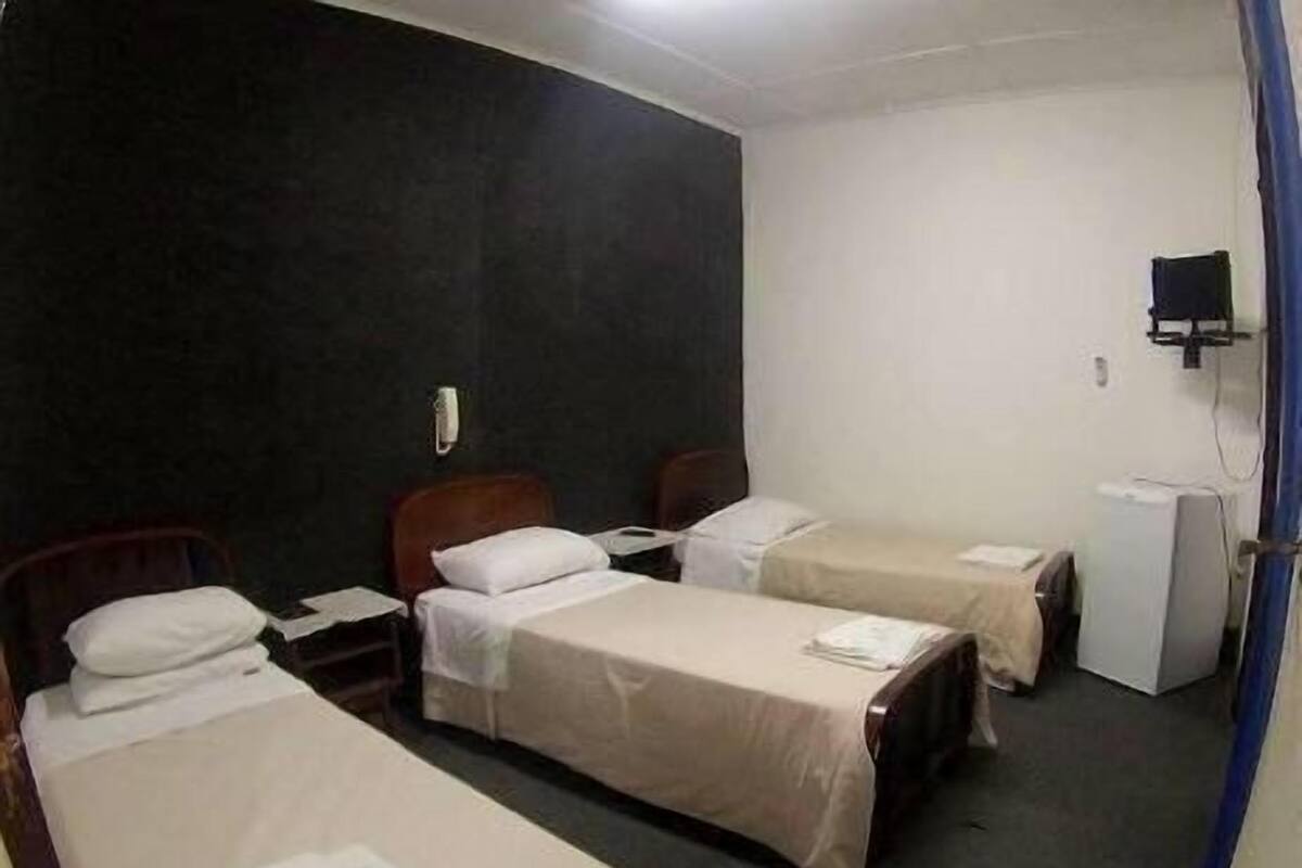 Triple Room | Minibar, desk, blackout drapes, free WiFi