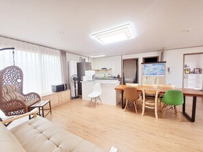 Deluxe Apartment, 3 Bedrooms | Living area | Pay movies