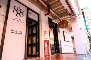 The entrance of Hotel Collection with a 'Walk-Ins Welcome' sign. - Rest Chinatown Hotel (Singapore)