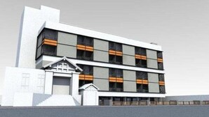 A modern multi-story building with a flat roof, large windows, and a prominent entrance with steps. - LKP Apartment (Kanchanaburi)