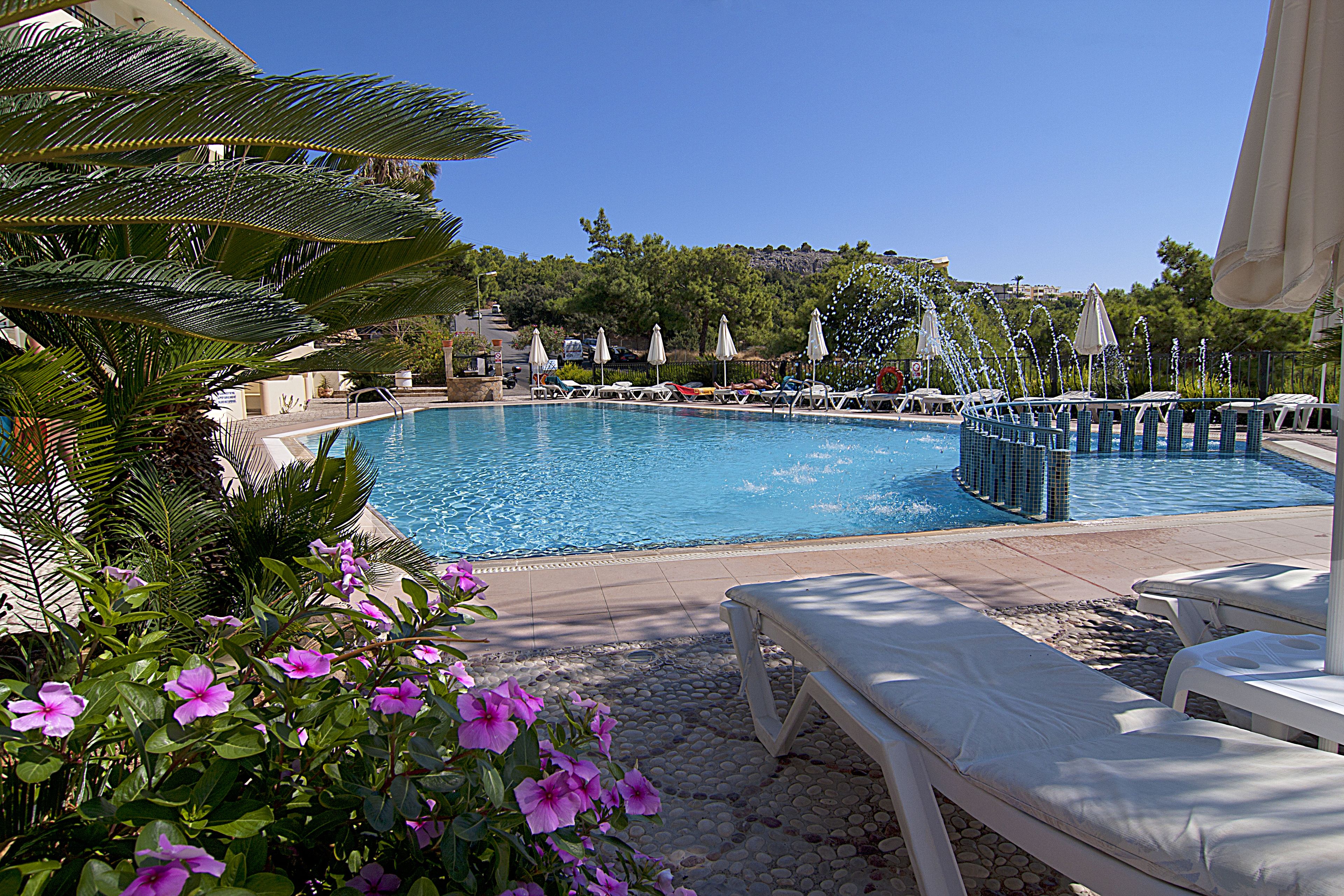 outdoor pool, pool umbrellas, pool loungers