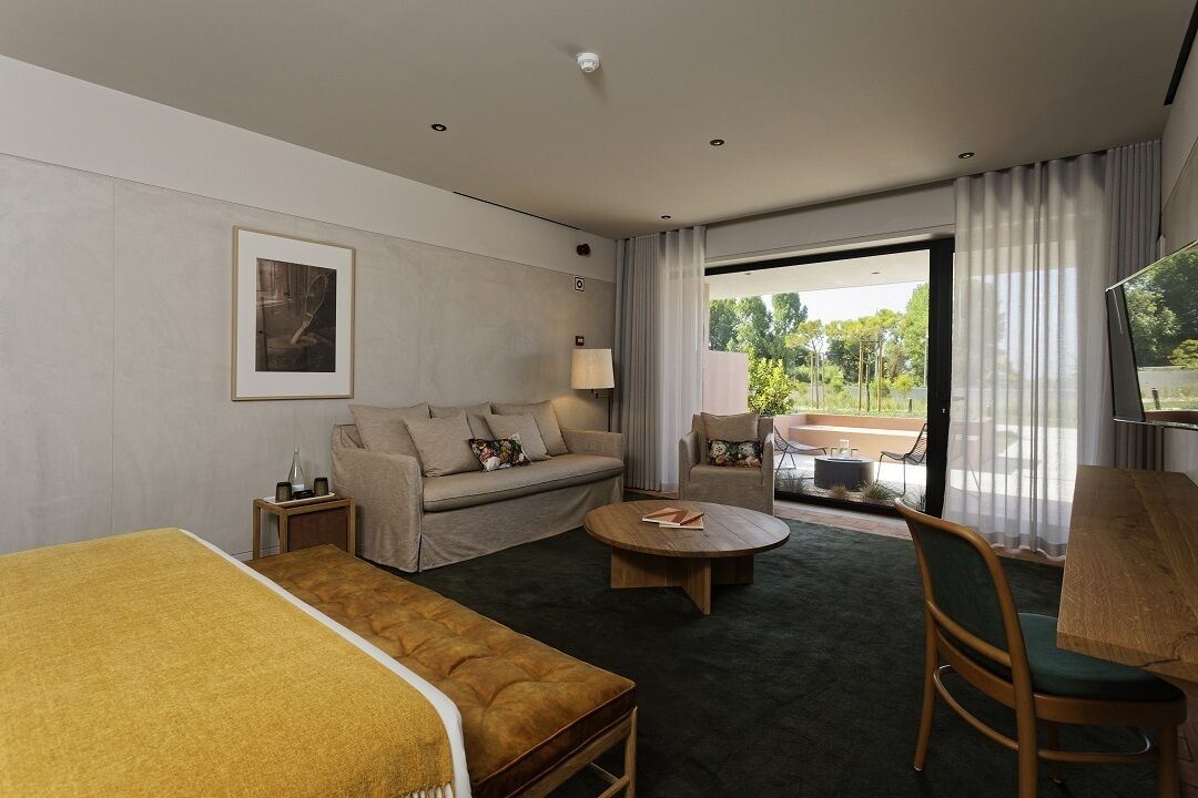 superior double room | living area | flat-screen tv