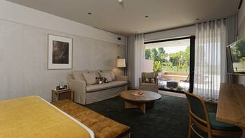 Quarto casal superior | Área de estar | TV de tela plana