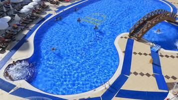Outdoor pool, open 7 AM to 8 PM, pool umbrellas, sun loungers