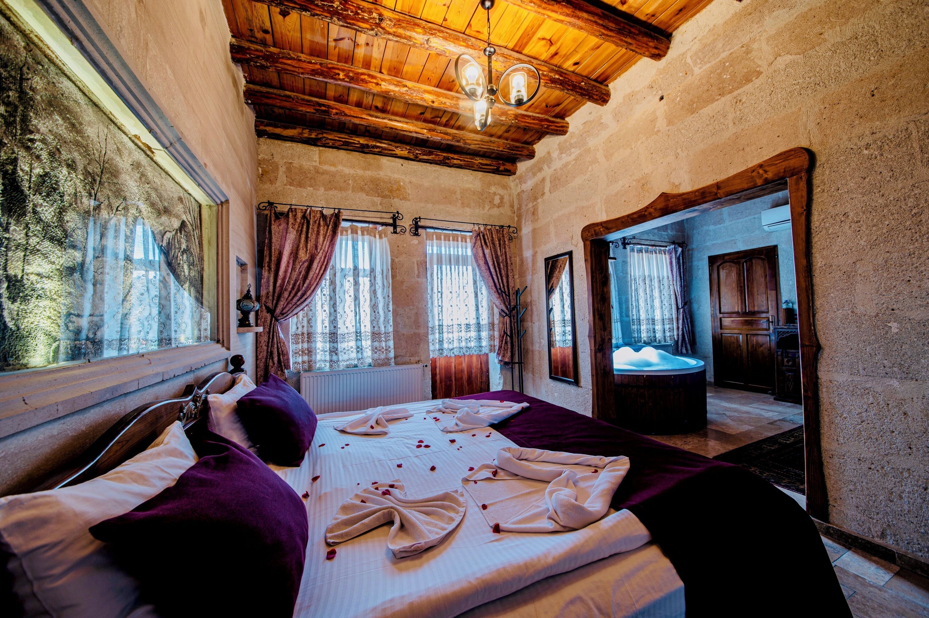 Superior Stone Suite Jacuzzi | Premium bedding, soundproofing, iron/ironing board, free WiFi