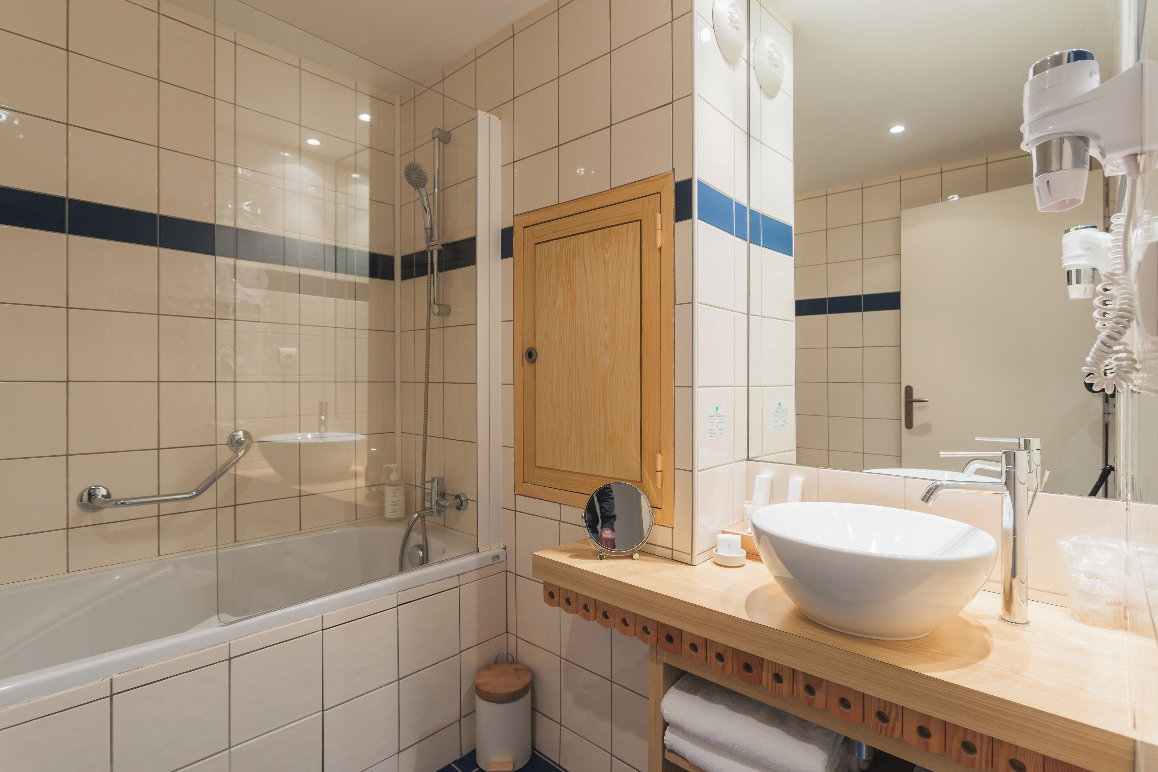 superior triple room | bathroom | bathtub, eco-friendly toiletries, hair dryer, bathrobes