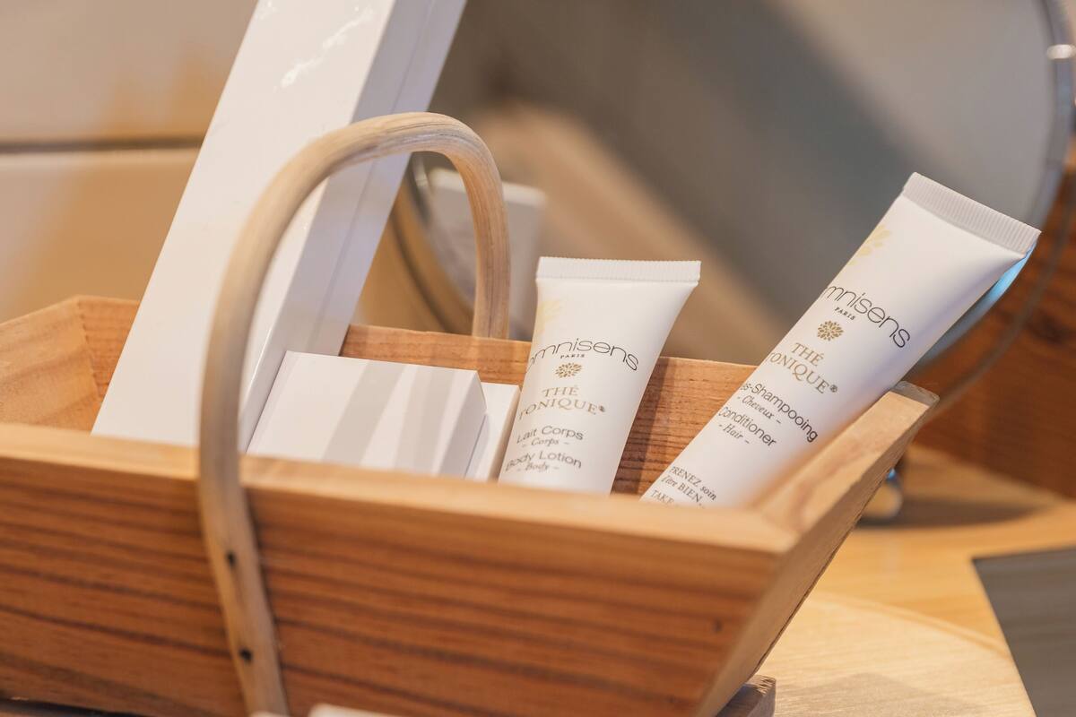 superior triple room | bathroom | bathtub, eco-friendly toiletries, hair dryer, bathrobes