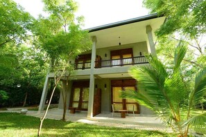 Deluxe Family Room | Minibar, in-room safe, desk, iron/ironing board