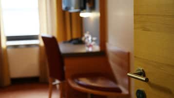A wooden door with a handle and a lock.