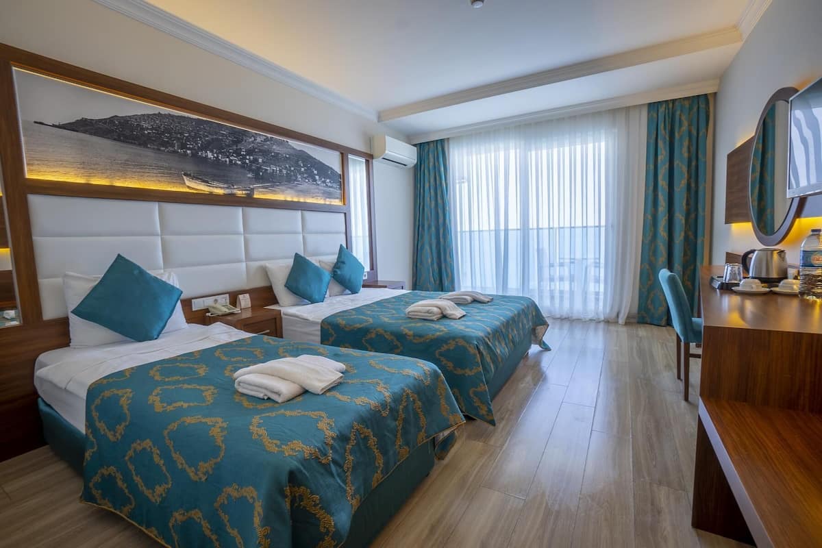 Minibar, desk, bed sheets