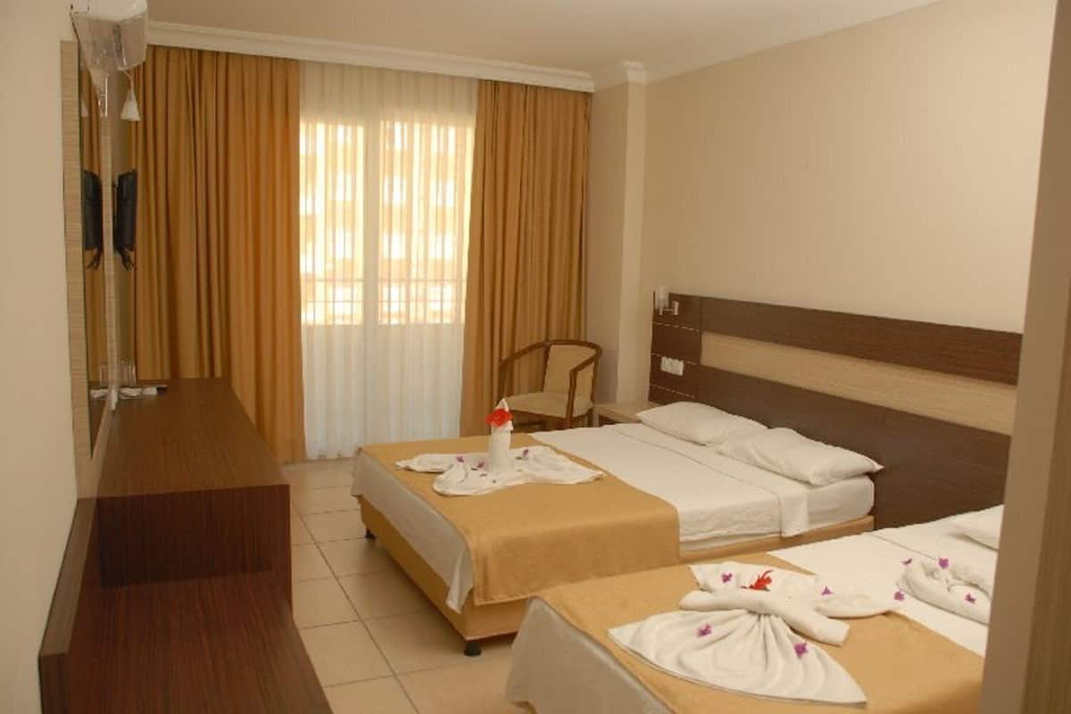 Minibar, desk, bed sheets