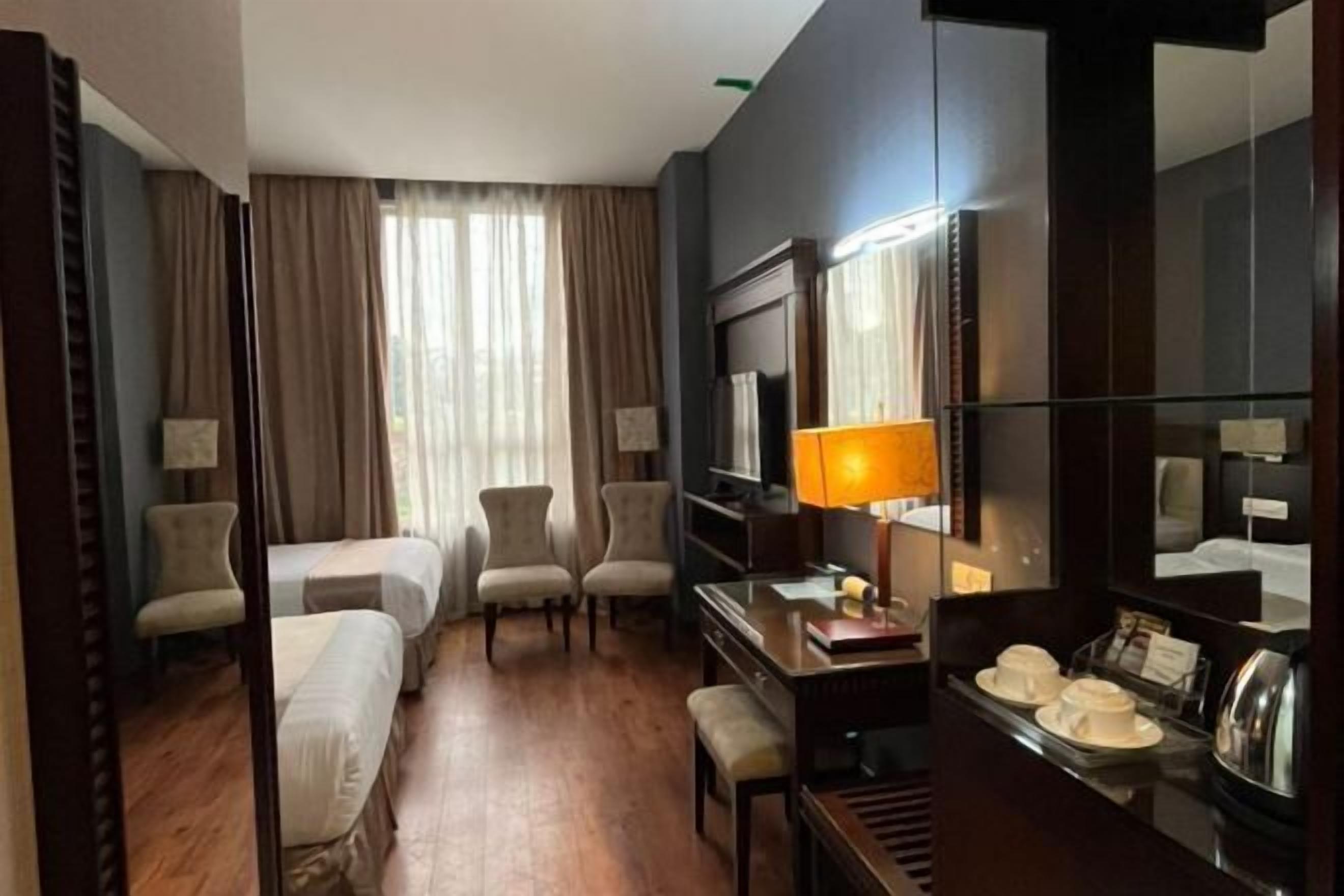 Desk, blackout drapes, soundproofing, iron/ironing board