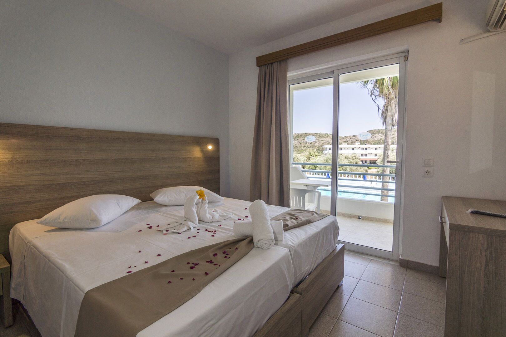 deluxe triple room, pool view | 3 bedrooms, iron/ironing board, free wifi, bed sheets