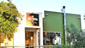 A restaurant named "The Grillroom" with a green exterior wall and a visible entrance. - The Coach House at Val du Charron (Wellington)