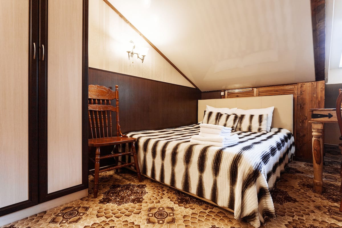 Suite junior, cocineta | Ropa de cama hipoalergénica y caja de seguridad en la habitación