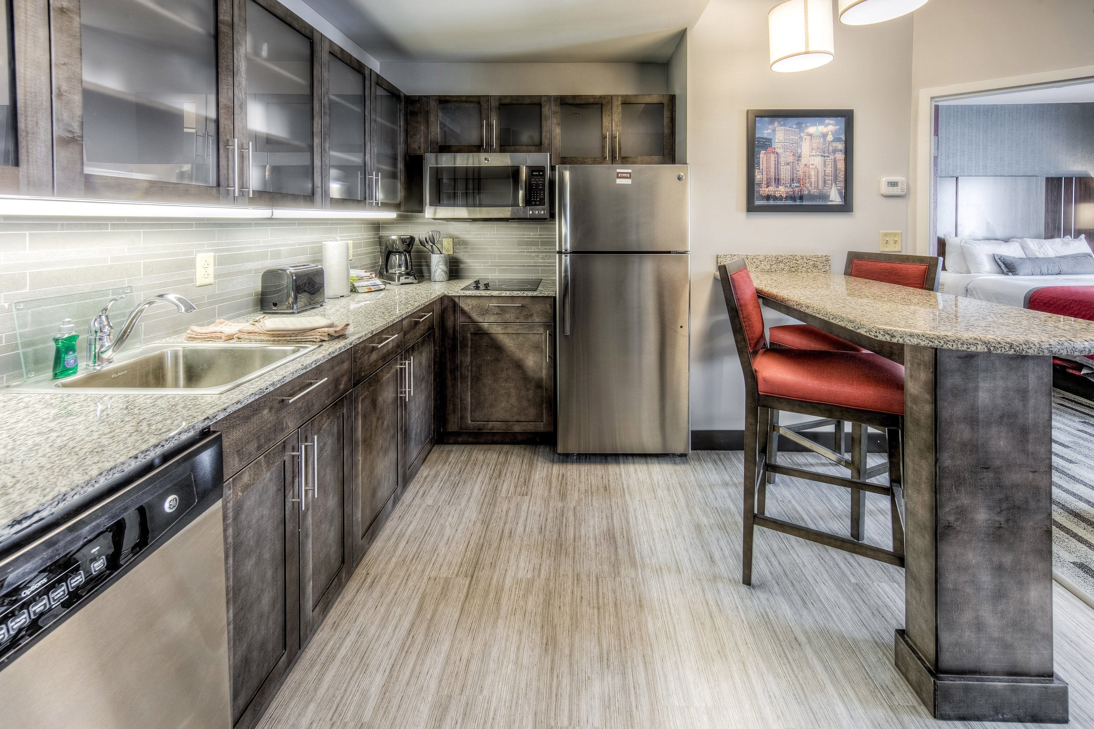 full-sized fridge, microwave, stovetop, coffee/tea maker