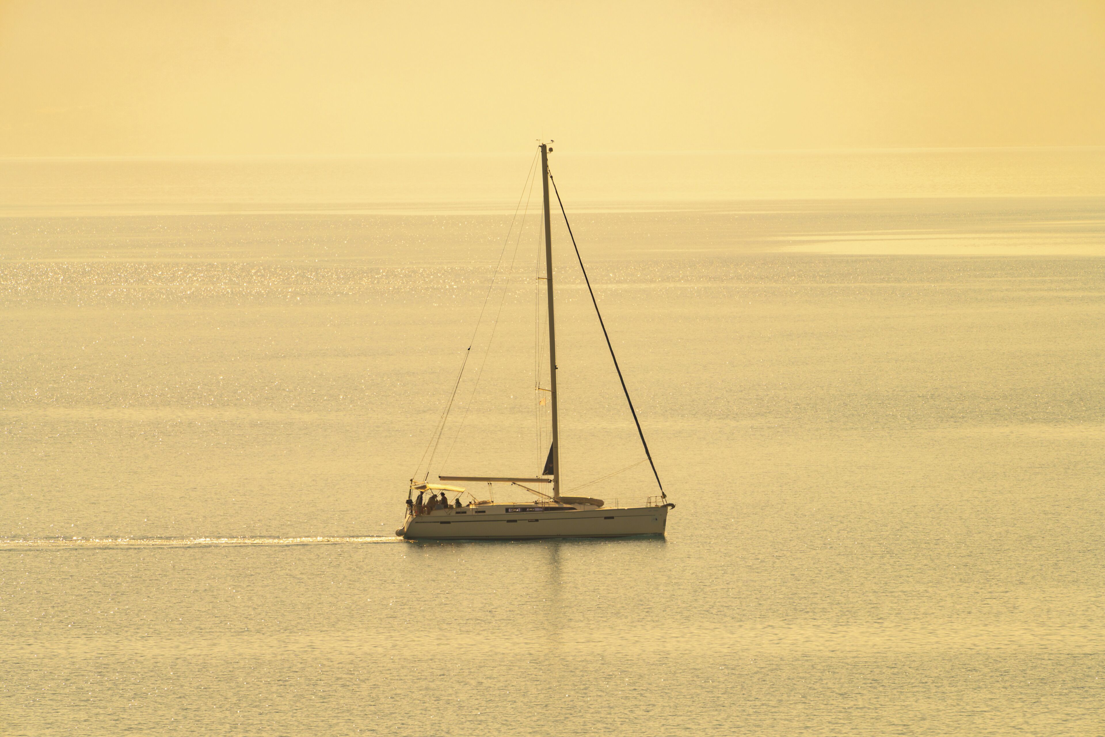 A sailboat on calm waters.
