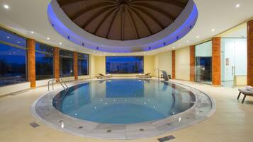 2 indoor pools, seasonal outdoor pool, pool umbrellas, pool loungers
