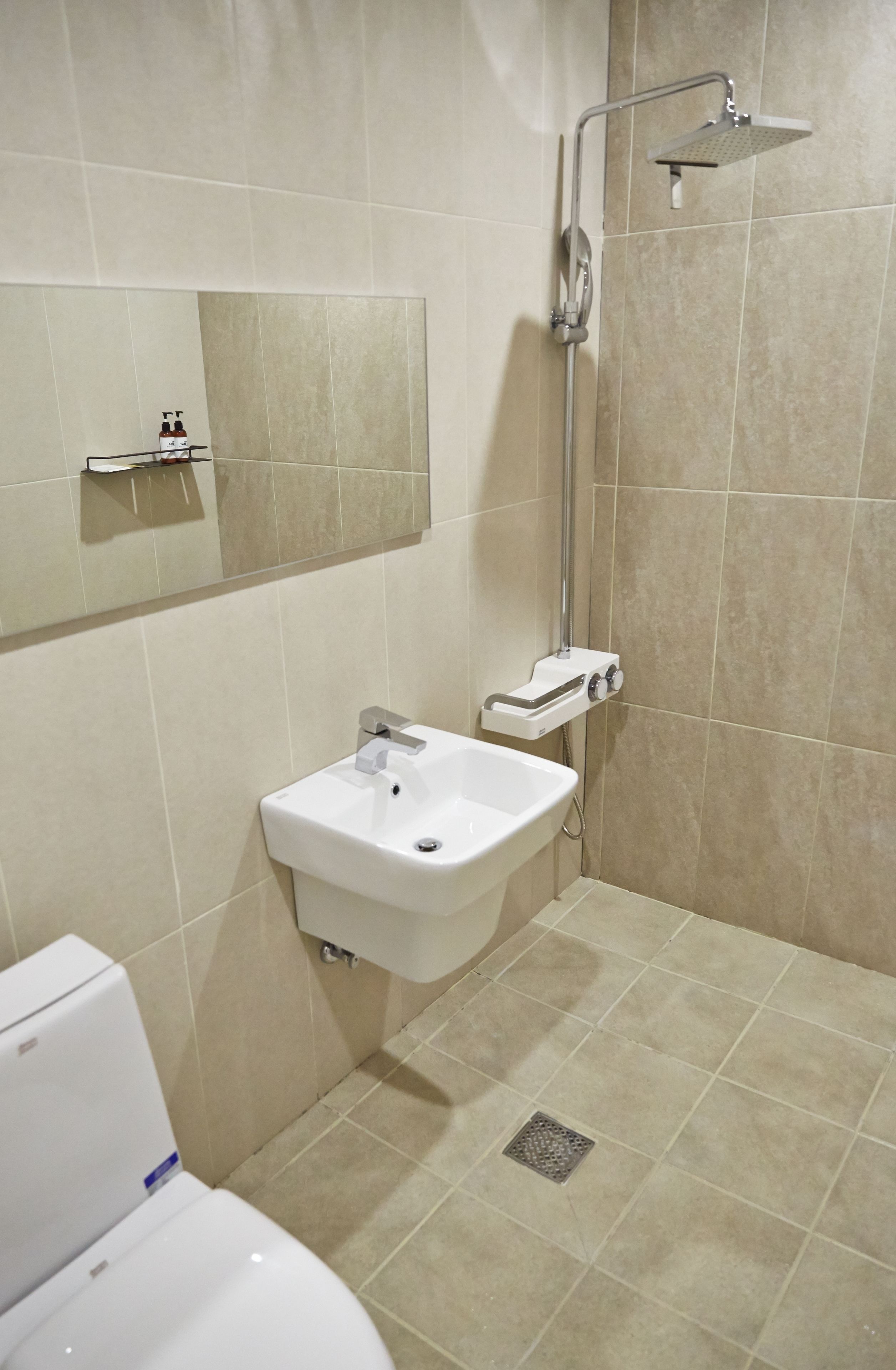 designer toiletries, hair dryer, bathrobes, slippers