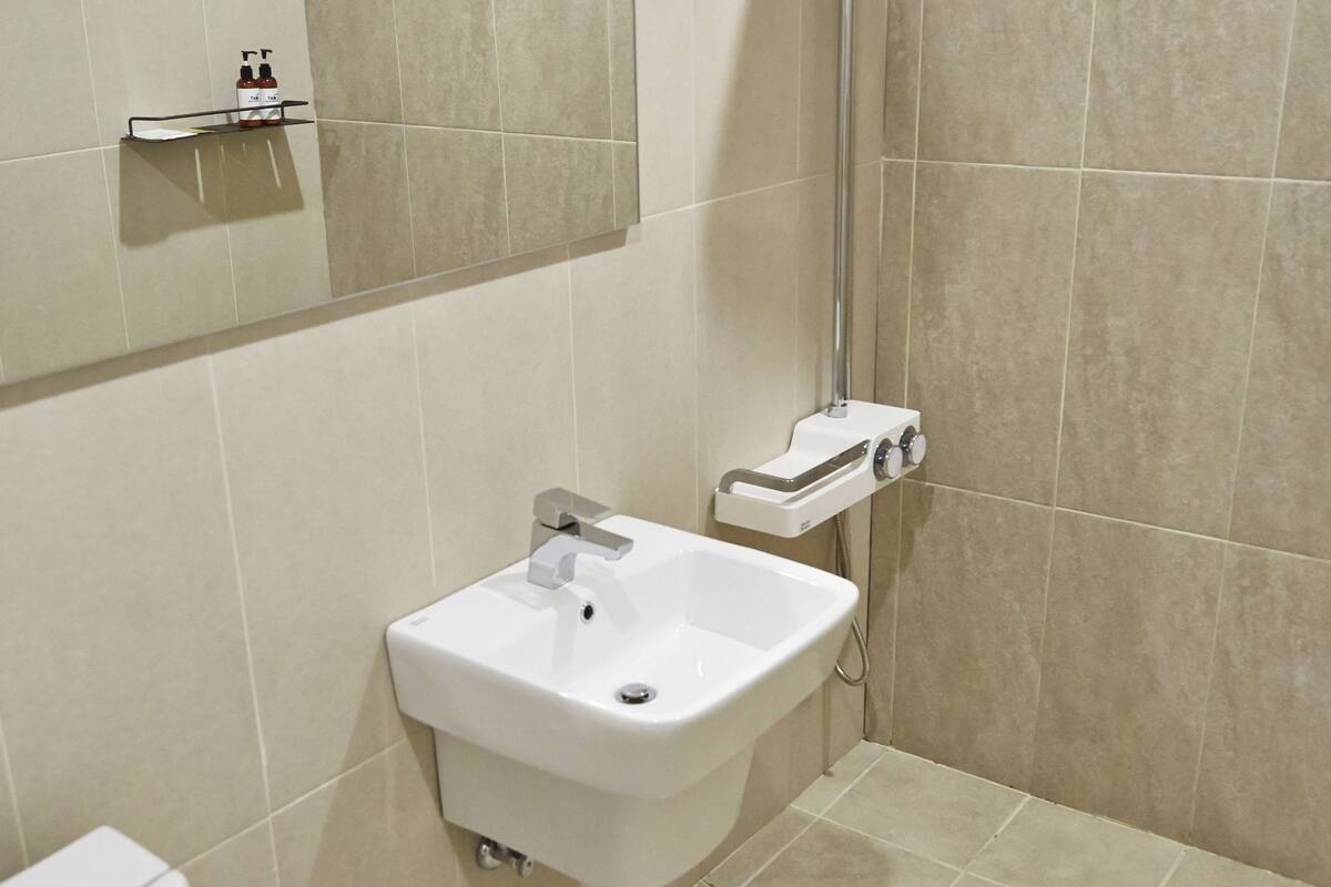 designer toiletries, hair dryer, bathrobes, slippers