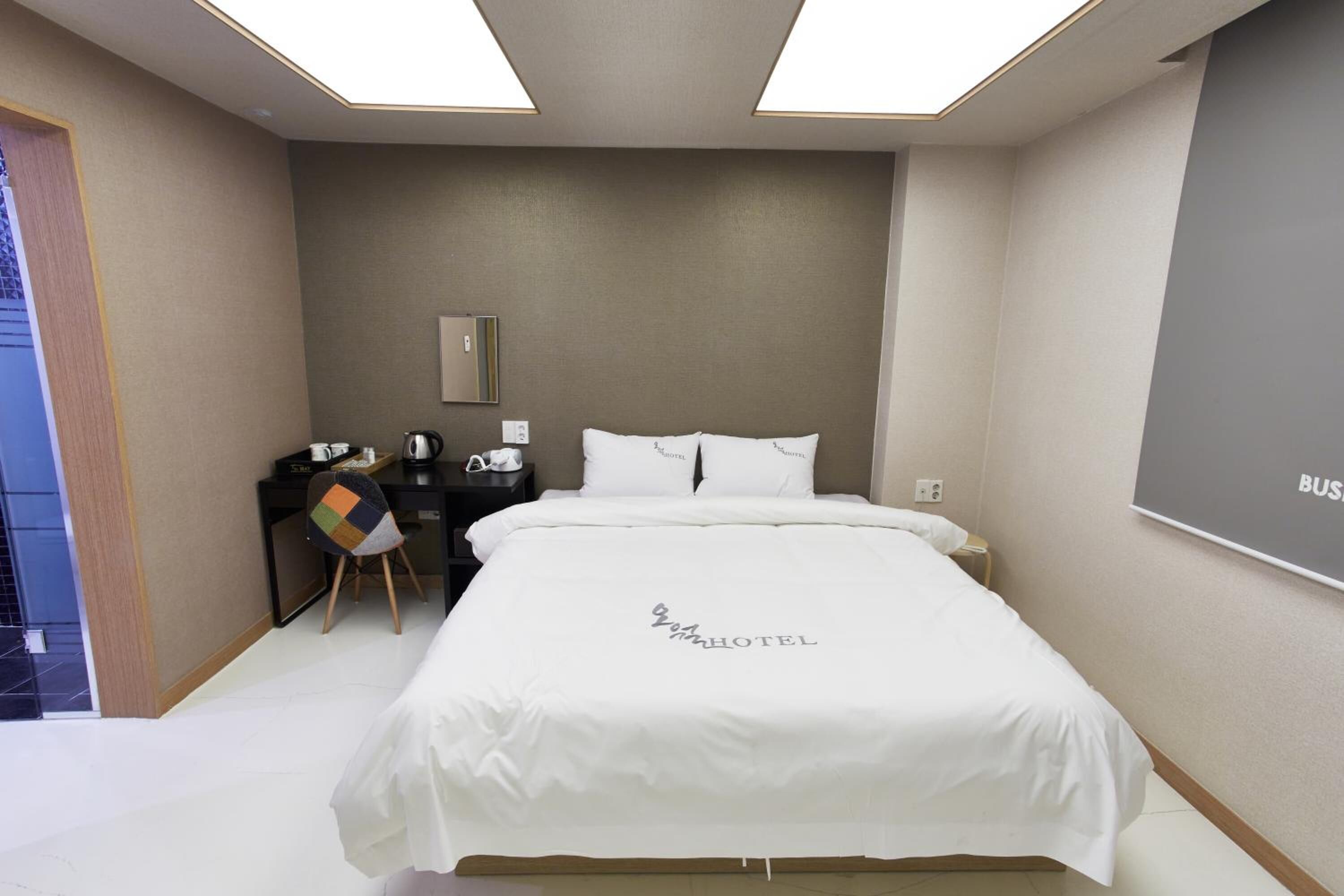 premium bedding, down duvets, desk, blackout curtains