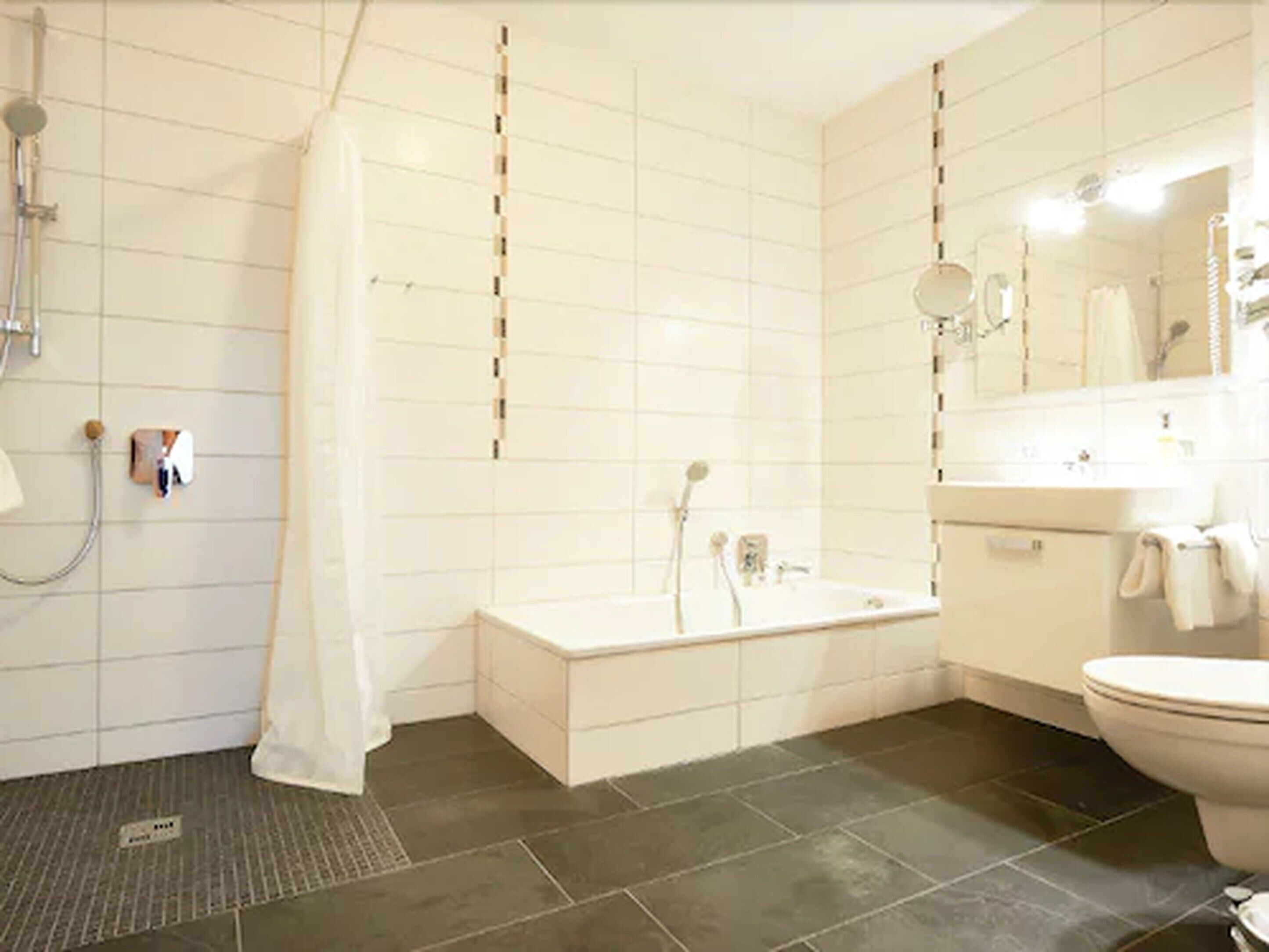 deluxe suite (superior) | bathroom | hair dryer, bathrobes, towels