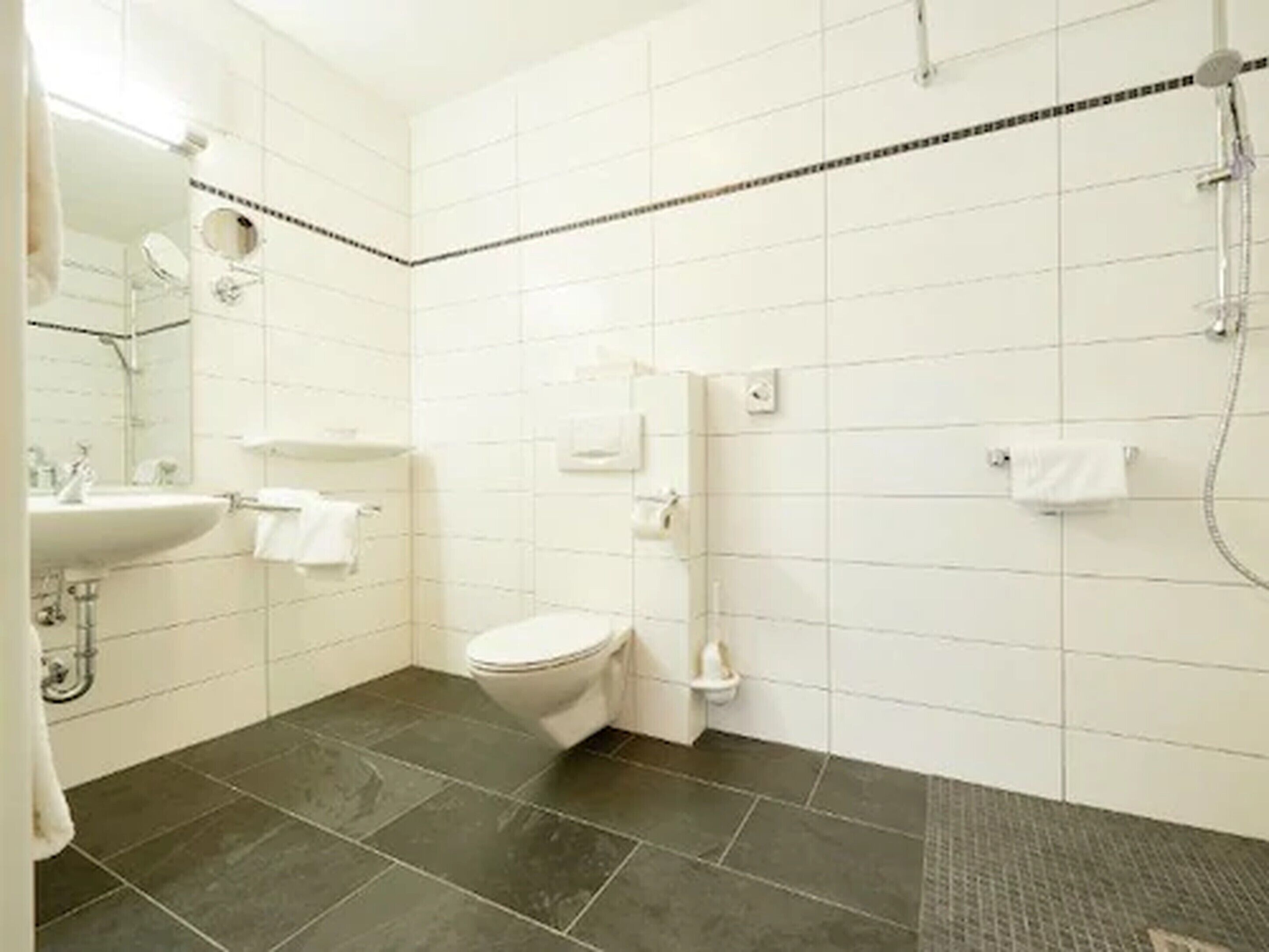 junior suite | bathroom | hair dryer, bathrobes, towels