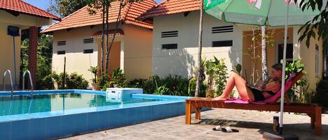 Outdoor pool, pool umbrellas, sun loungers
