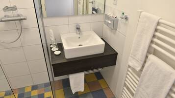 Shower, free toiletries, hair dryer, slippers