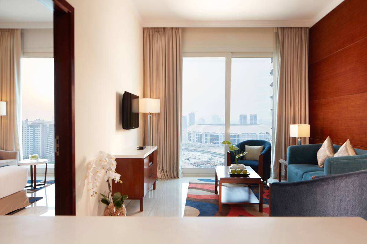 Family Apartment, 2 Bedrooms, Balcony | Living area | 50-inch Smart TV with cable channels, TV
