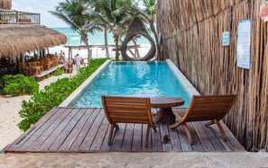 Outdoor pool, open 8:00 AM to 8:00 PM, pool umbrellas, sun loungers - Dune Boutique Hotel located at the party zone (Tulum)