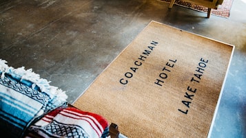 A doormat with the text "COACHMAN HOTEL LAKE TAHOE".