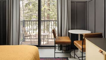 Premium Room, 1 King Bed | Living area | 50-inch Smart TV with cable channels, TV, streaming services