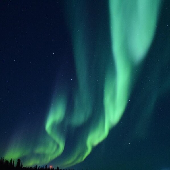 A night sky with the Northern Lights.