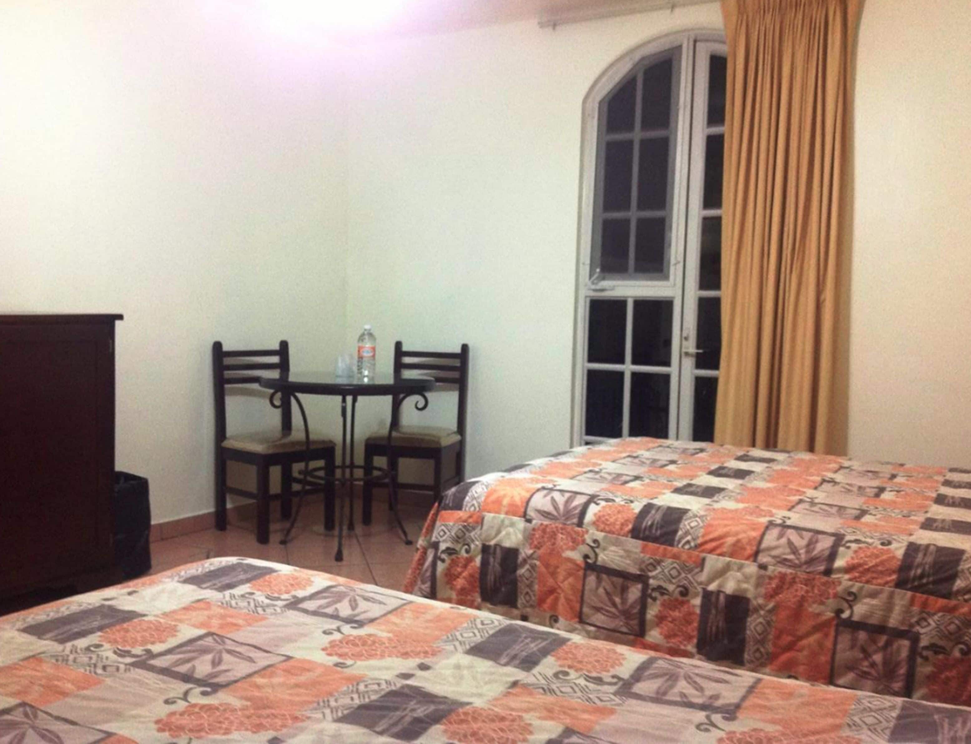 double room, 2 double beds | desk, free cots/infant beds, rollaway beds, free wifi