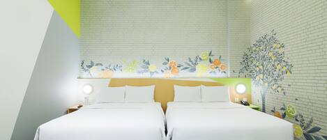 A hotel room with two beds, a skylight, a brick wall, and a floral mural.