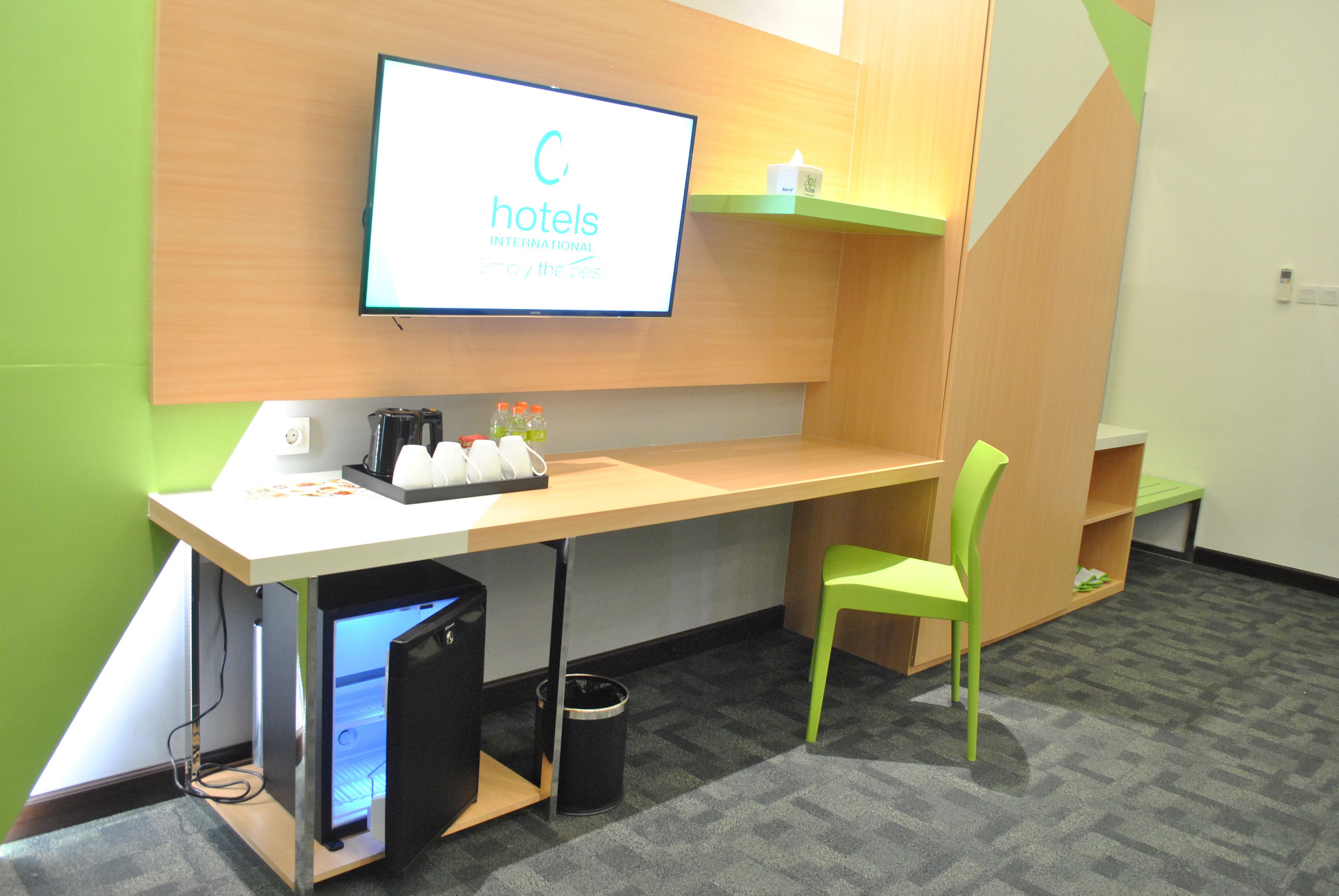 zest family room  | in-room safe, desk, laptop workspace, iron/ironing board