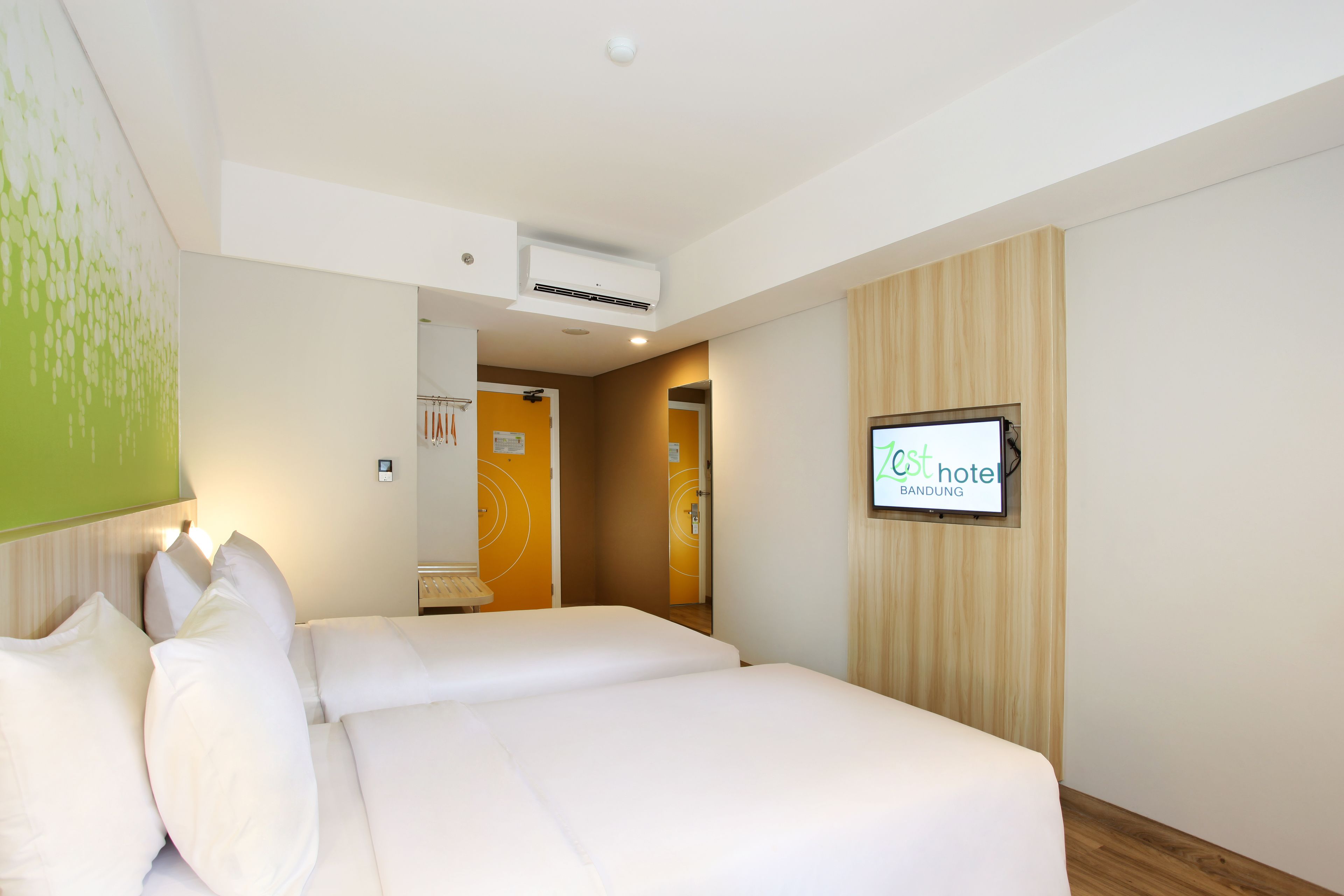 zest twin room | in-room safe, desk, laptop workspace, iron/ironing board