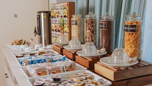 A buffet with various food items and condiments. - Hotel Amico (Citta Sant'Angelo)