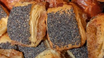 A variety of pastries, including some with poppy seeds.