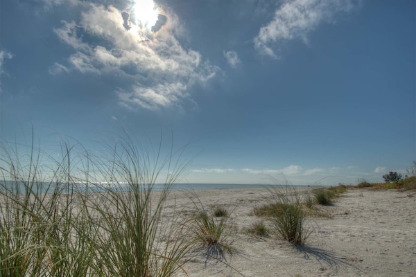 Beach nearby, white sand, sun loungers, beach umbrellas