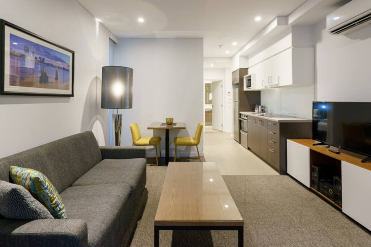 One Bedroom Apartment | Living area | 32-inch LCD TV with cable channels, TV, offices