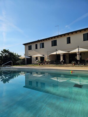 Outdoor pool, open 9:00 AM to 7:00 PM, pool umbrellas, sun loungers