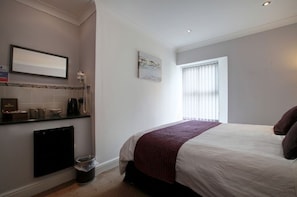 Egyptian cotton sheets, down duvets, in-room safe