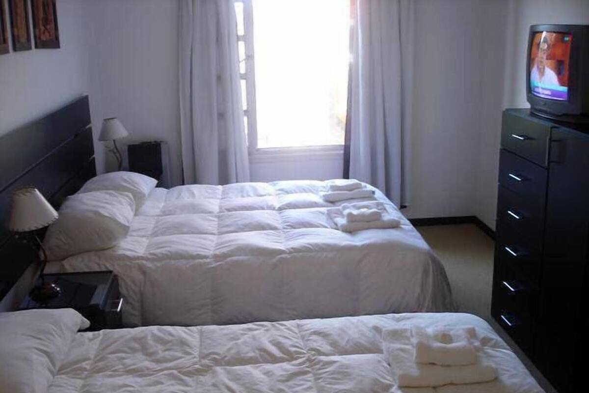 Habitación triple, varias camas