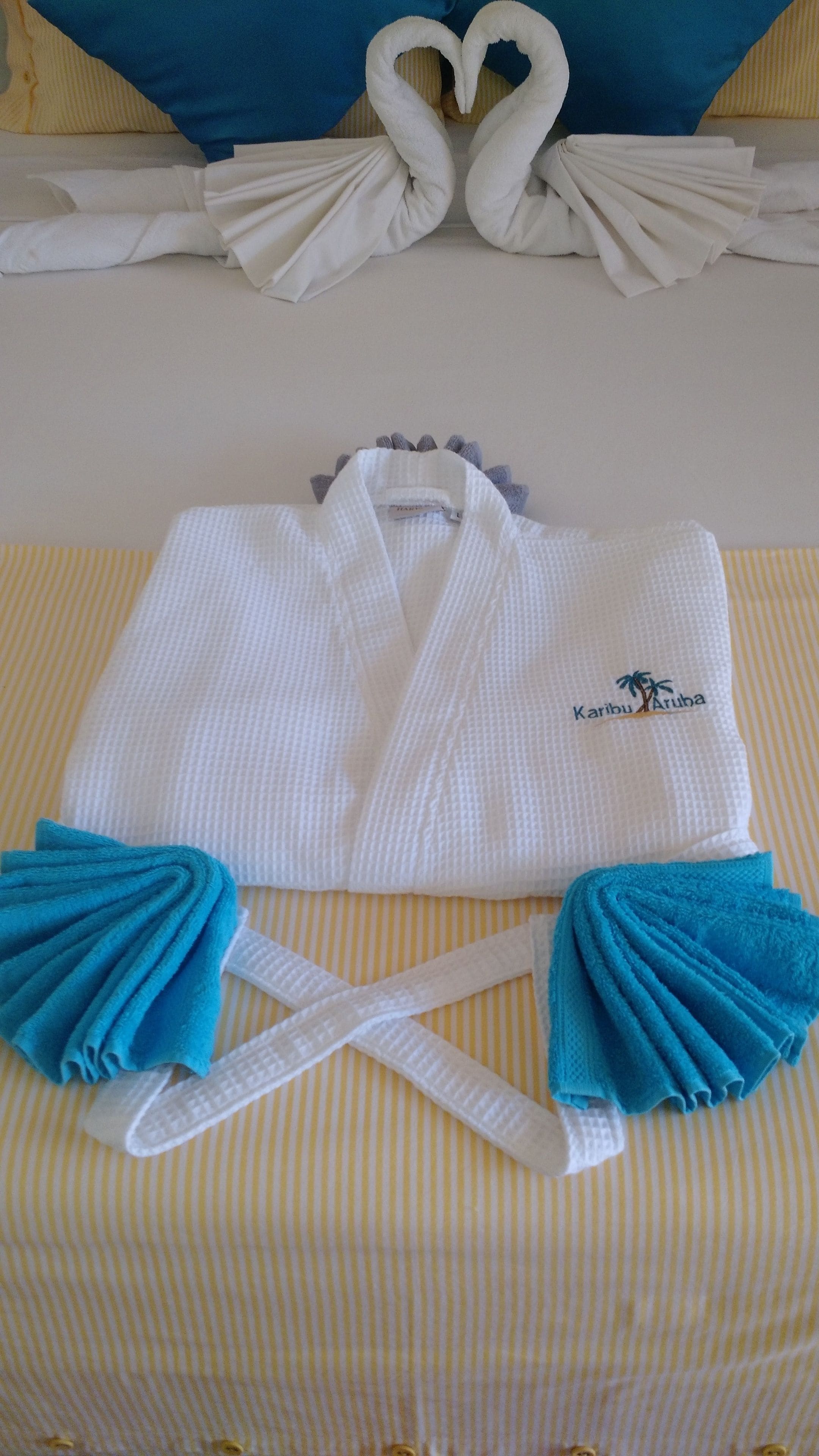 designer toiletries, hair dryer, bathrobes, slippers